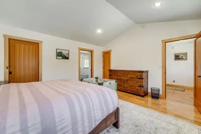 a bedroom with a bed and a wooden dresser at 5 Mi to Northstar Resort! Family Home with Hot Tub in Truckee