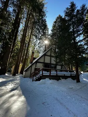 a cabin in the woods in the snow at Bear Meadow Cabin at Shaver Lake in Shaver Lake