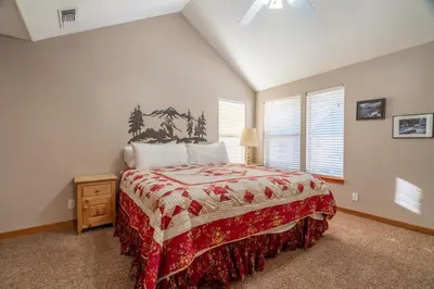a bedroom with a large bed in a room at RR-Hideaway_Down_Cyn 105 in June Lake