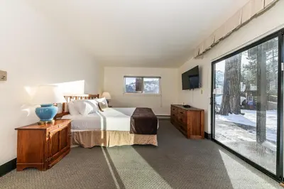 a bedroom with a bed and a large window at 136 Bldg C condo in Truckee