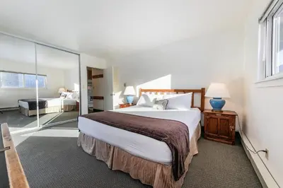 a bedroom with a large bed and a large window at 136 Bldg C condo in Truckee
