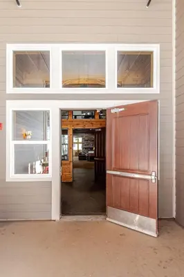 an open garage door in a house with a door at Kirkwood Studio Full Kitchen & Meadow Balcony in Kirkwood