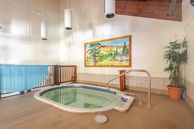 a jacuzzi tub in the middle of a room at Kirkwood Studio Full Kitchen & Meadow Balcony in Kirkwood