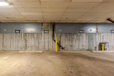 an empty parking garage with numbers on the wall at Kirkwood Studio Full Kitchen & Meadow Balcony in Kirkwood