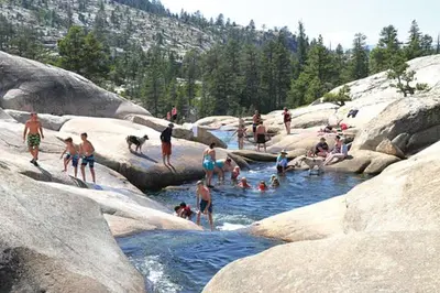 a group of people swimming in a river at The Lookout Loft Great views and King Sized Bed in Kirkwood