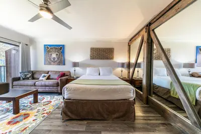 a bedroom with a bed and a couch at 242 Bldg C condo in Truckee