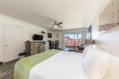 a bedroom with a large white bed and a window at 242 Bldg C condo in Truckee