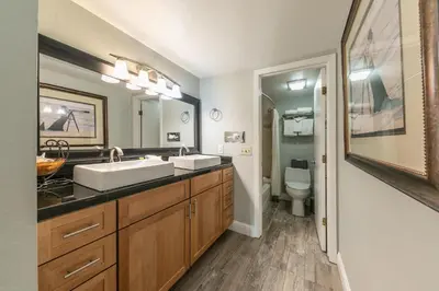 a bathroom with two sinks and a toilet at 125 Bldg B condo in Truckee