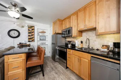 a kitchen with wooden cabinets and a sink at 125 Bldg B condo in Truckee