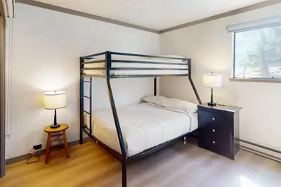 a bedroom with a bunk bed and two lamps at Mammoth Point 119 in Mammoth Lakes