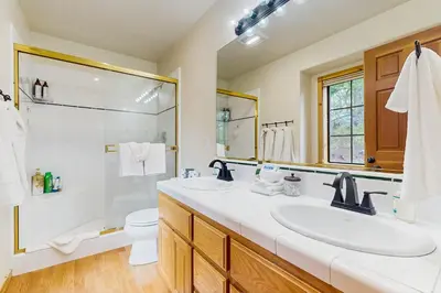 a bathroom with a sink and a shower and a toilet at Chill on the Hill in Truckee