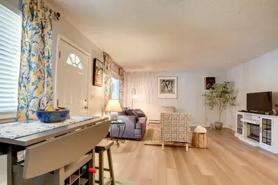 a living room with a couch and a table at 1 Mi to Reno-Sparks Family Retreat with Fireplace! in Reno