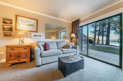 a living room with a couch and a table at 146 Bldg C condo in Truckee