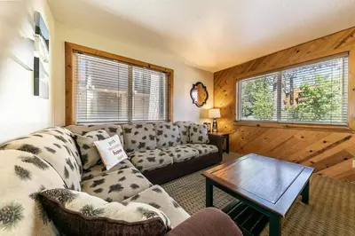 a living room with a couch and a table at 117 Bldg B condo in Truckee