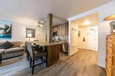 a kitchen and living room with a table and a couch at 115 Bldg B studio in Truckee
