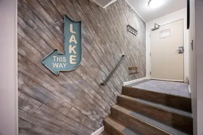 a brick wall with a sign that reads ask this this way at 124 Bldg B studio in Truckee