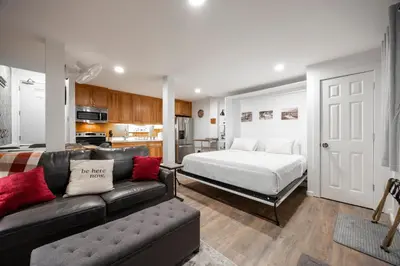 a living room with a couch and a bed at 124 Bldg B studio in Truckee