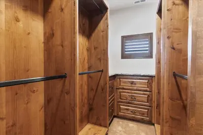 a bathroom with wooden walls and a wooden closet at Reno Basecamp 2 King Suites, Walk to Food and Fun in Reno