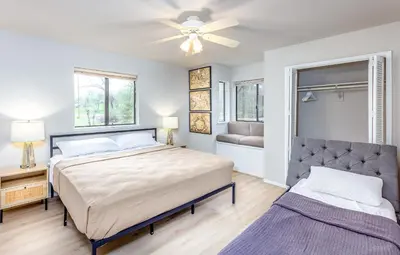 a bedroom with two beds and a ceiling fan at Grand Riverside Retreat - Private Walkway to the River in Three Rivers