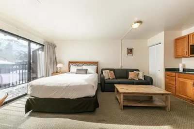 a bedroom with a bed and a couch at 226 Bldg B condo in Truckee