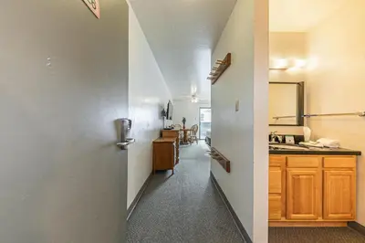 a hallway leading to a kitchen with a sink at 226 Bldg B condo in Truckee