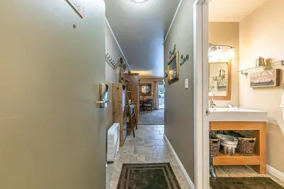 a hallway of a house with a sink and a refrigerator at 132 Bldg C condo in Truckee