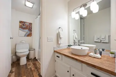 a white bathroom with a sink and a toilet at 114 Bldg B condo in Truckee