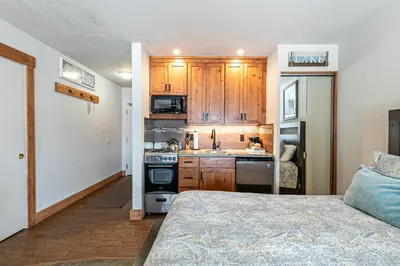 a kitchen with wooden cabinets and a stove top oven at 243 Bldg C condo in Truckee