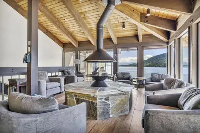 a living room with couches and a table with a fireplace at 111 Bldg B condo in Truckee