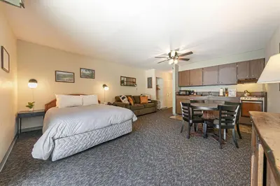 a large bedroom with a bed and a kitchen at 134 Bldg C studio in Truckee