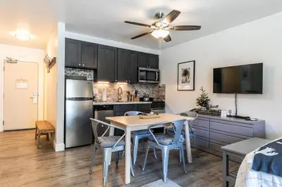 a kitchen and dining room with a table and chairs at 245 Bldg C condo in Truckee
