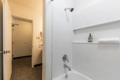 a bathroom with a shower and a bath tub at 211 Bldg B condo in Truckee