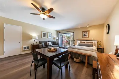 a bedroom with a bed and a table and a dining room at 246 Bldg C condo in Truckee