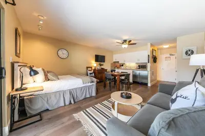 a bedroom with a bed and a living room at 246 Bldg C condo in Truckee