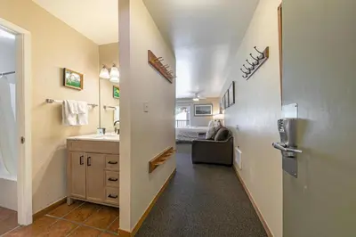 a hallway with a bathroom with a sink and a toilet at 217 Bldg B condo in Truckee