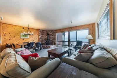 a living room with a couch and a table at 154 Bldg D townhouse in Truckee