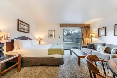 a hotel room with a bed and a couch at 144 Bldg C condo in Truckee