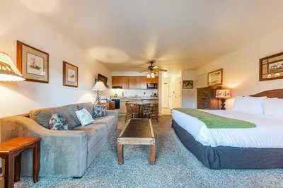 a hotel room with a bed and a couch at 144 Bldg C condo in Truckee