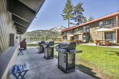 a row of trash cans sitting outside of a building at 213 Bldg B condo in Truckee