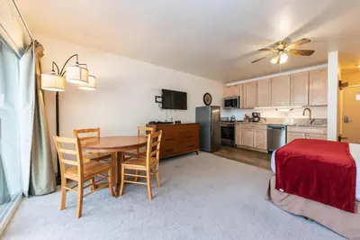 a kitchen and dining room with a table and chairs at 213 Bldg B condo in Truckee