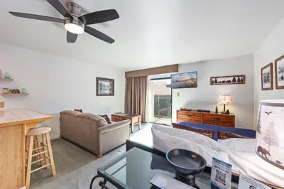a living room with a couch and a ceiling fan at 223 Bldg B condo in Truckee