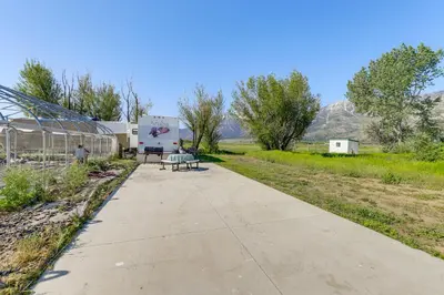 a sidewalk with a bench in the middle of a field at 11 Mi to Heavenly Mtn Resort Getaway with Mtn Views in Gardnerville