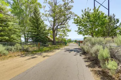 a dirt road with trees and a fence at 11 Mi to Heavenly Mtn Resort Getaway with Mtn Views in Gardnerville