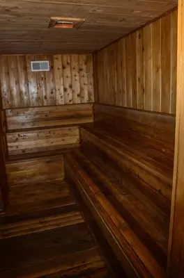 an empty sauna with wooden walls and wooden floors at Chamonix #093 - Near Skiing Hiking & More in Mammoth Lakes