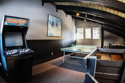 a room with a pool table and a arcade game at Chamonix #093 - Near Skiing Hiking & More in Mammoth Lakes