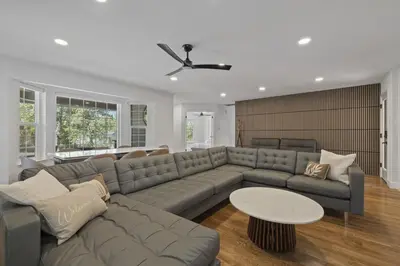 a living room with a couch and a table at New Listing - 5bd 3ba Retreat for a large group in Groveland