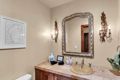 a bathroom with a sink and a mirror at Star Haven Game Room & Forest Views in Truckee