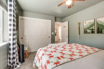 a bedroom with a bed and a ceiling fan at Hike, Swim and Golf Home Near Dtwn Twain Harte in Twain Harte