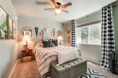 a bedroom with a bed and a ceiling fan at Hike, Swim and Golf Home Near Dtwn Twain Harte in Twain Harte