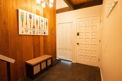 a hallway with a bench and a white door at 2xKing, Balconies, 350mbps. Loft, Near Northstar in Kings Beach
